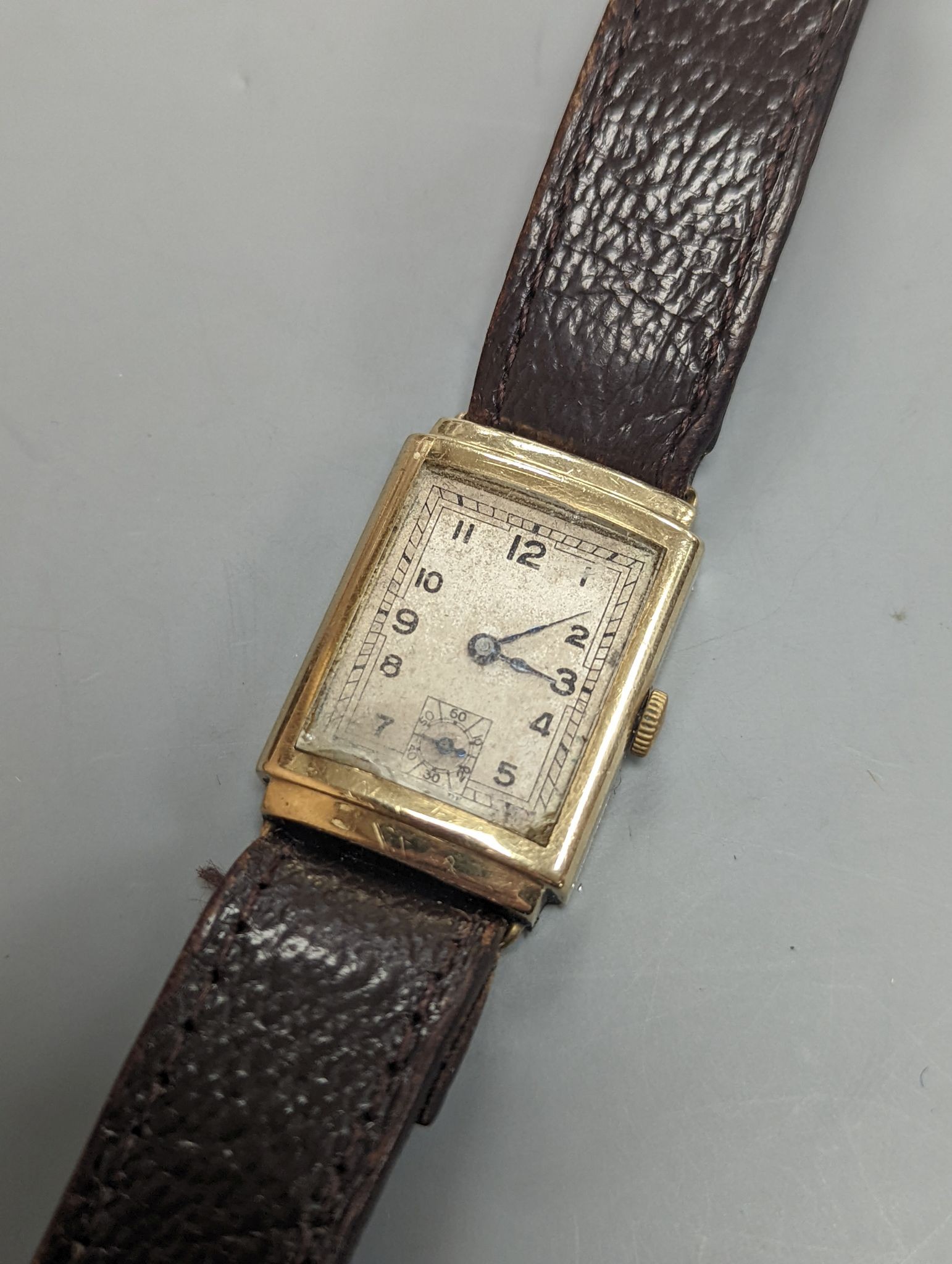 A gentleman's 1930's 9ct gold rectangular dial manual wind gold wrist watch.